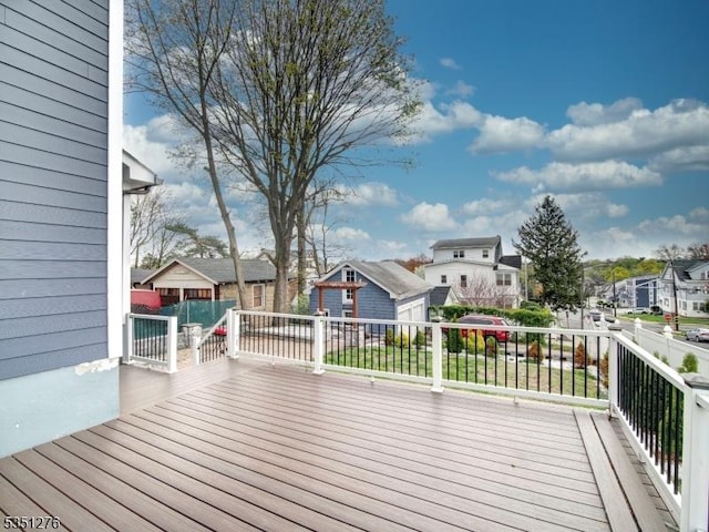 wooden deck featuring a residential view