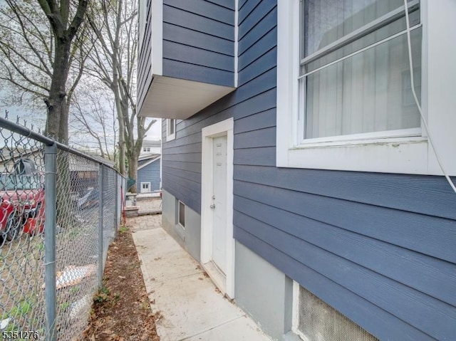 view of home's exterior with fence
