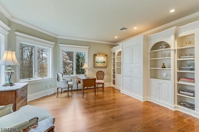 living area with light wood finished floors, ornamental molding, baseboards, and recessed lighting