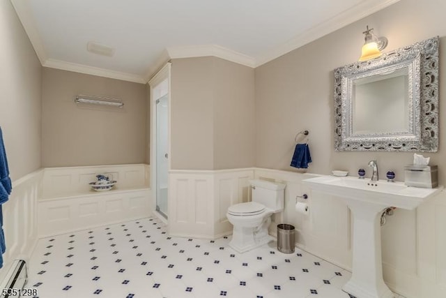 bathroom with toilet, wainscoting, ornamental molding, a decorative wall, and a stall shower