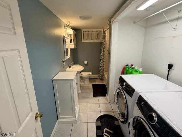 326 Spring Garden Rd, Holland Twp, NJ 08848 - washroom featuring washer and clothes dryer, light tile patterned floors, and baseboards