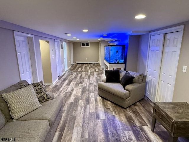 326 Spring Garden Rd, Holland Twp, NJ 08848 - living room featuring a baseboard radiator, wood finished floors, recessed lighting, and baseboards