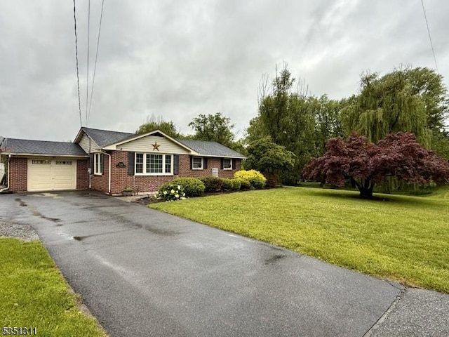 326 Spring Garden Rd, Holland Twp, NJ 08848 - ranch-style house featuring a garage, brick siding, asphalt driveway, and a front yard