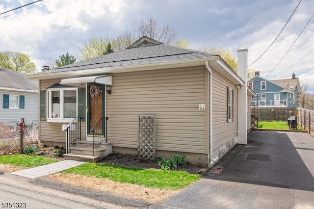 49 Nestor St, Franklin Boro, NJ 07416 - bungalow-style home featuring roof with shingles, driveway, and fence