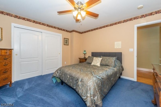 carpeted bedroom featuring a closet, ceiling fan, and baseboards