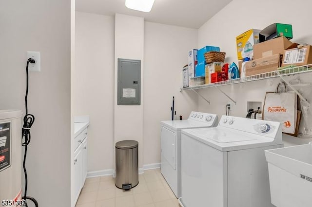 washroom featuring washer and clothes dryer, baseboards, a sink, and electric panel