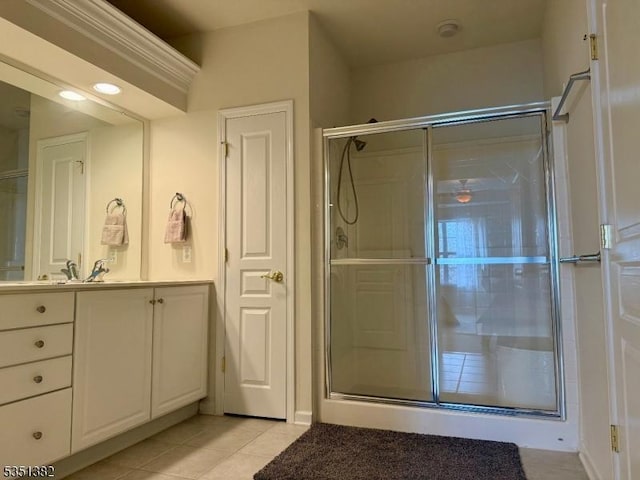 full bathroom featuring a shower stall, tile patterned flooring, and vanity