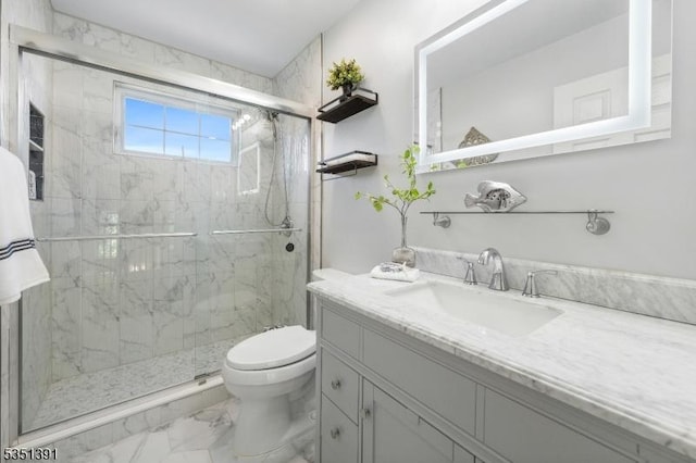 bathroom with toilet, a marble finish shower, marble finish floor, and vanity