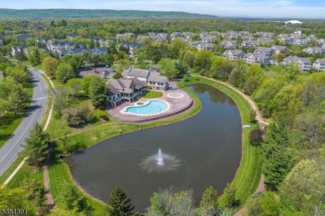 birds eye view of property featuring a water view and a residential view