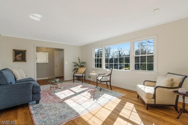 interior space with baseboards and wood finished floors