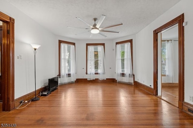 70 Highwood Ave, Englewood City, NJ 07631 - unfurnished living room featuring hardwood / wood-style flooring, ceiling fan, and a textured ceiling