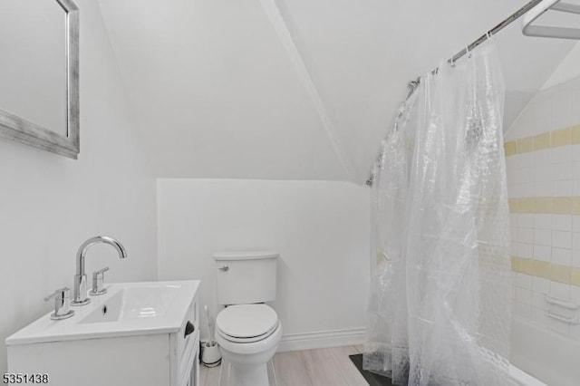 70 Highwood Ave, Englewood City, NJ 07631 - bathroom with vanity, shower / bath combination with curtain, vaulted ceiling, and wood finished floors