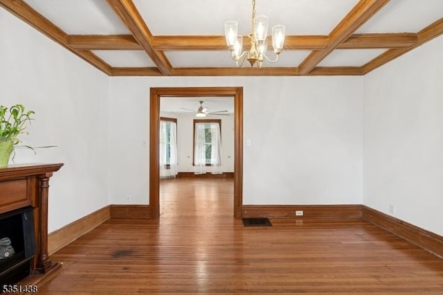 70 Highwood Ave, Englewood City, NJ 07631 - unfurnished dining area with coffered ceiling, hardwood / wood-style floors, a chandelier, beamed ceiling, and a fireplace