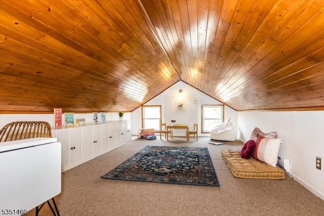 bonus room featuring vaulted ceiling, wood ceiling, carpet flooring, and a baseboard heating unit