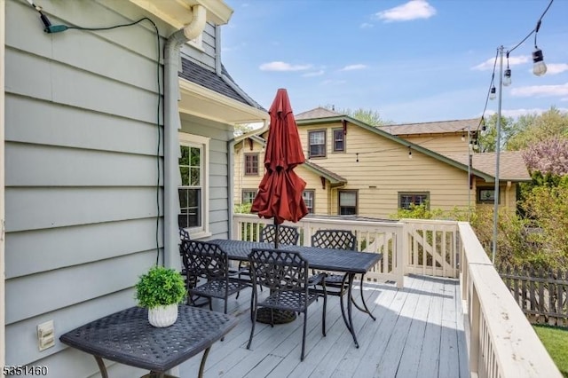 wooden deck with outdoor dining space