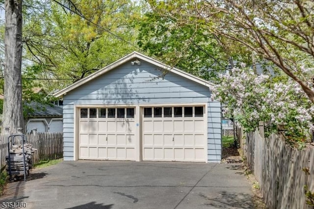 detached garage with fence