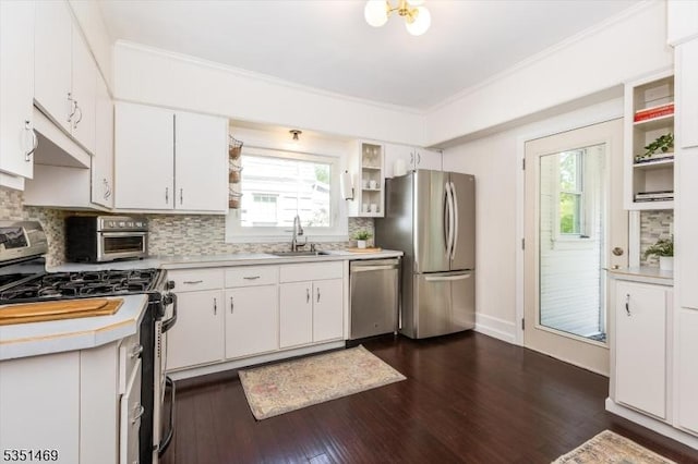 kitchen with open shelves, a sink, light countertops, stainless steel appliances, and under cabinet range hood