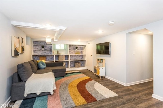 living room with baseboards and wood finished floors