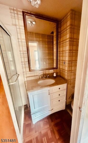 57 Kensington Ct, Washington Twp, NJ 07840 - full bath featuring vanity, a stall shower, and wallpapered walls