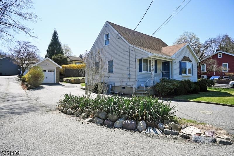 11 Cotter Ave, Butler Boro, NJ 07405 - view of side of home featuring an outdoor structure and a garage