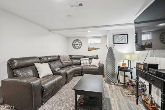living room featuring wood finished floors and visible vents