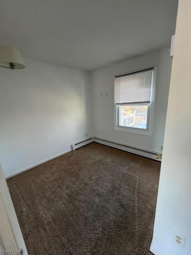 244 Dupont Ave, Hopatcong Boro, NJ 07843 - unfurnished room featuring baseboards, dark carpet, and a baseboard radiator