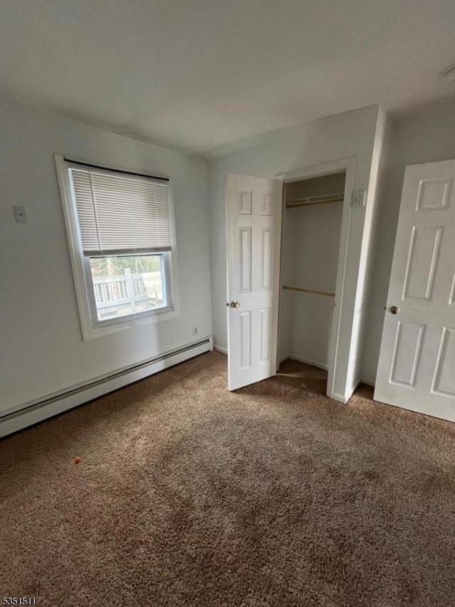 244 Dupont Ave, Hopatcong Boro, NJ 07843 - unfurnished bedroom featuring a baseboard heating unit, baseboards, carpet, and a closet