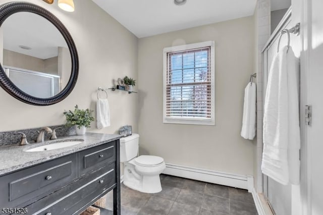 bathroom featuring a baseboard heating unit, tile patterned floors, toilet, a shower stall, and vanity