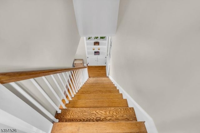 stairs with wood finished floors
