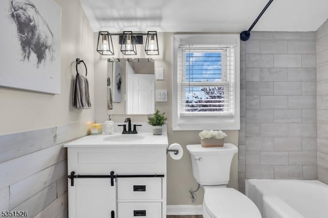 full bathroom featuring bathing tub / shower combination, vanity, and toilet