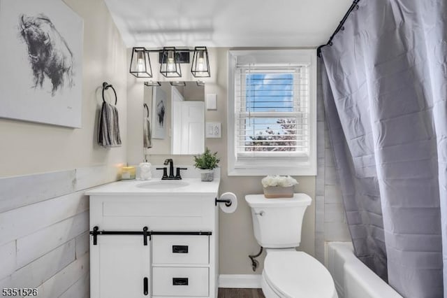 full bathroom with toilet, vanity, and shower / bathtub combination with curtain