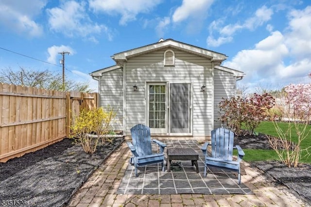 view of patio / terrace featuring fence