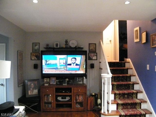 living room with stairway, recessed lighting, and wood finished floors