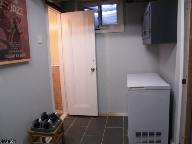 1408 Orchard Ter, Hillside Twp, NJ 07205 - laundry room with dark tile patterned floors