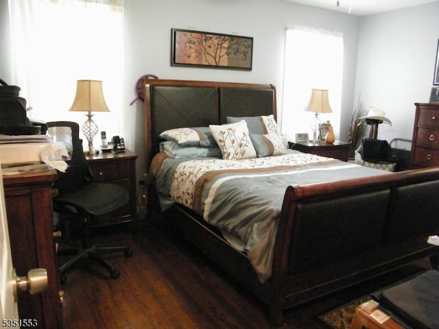 bedroom with wood finished floors