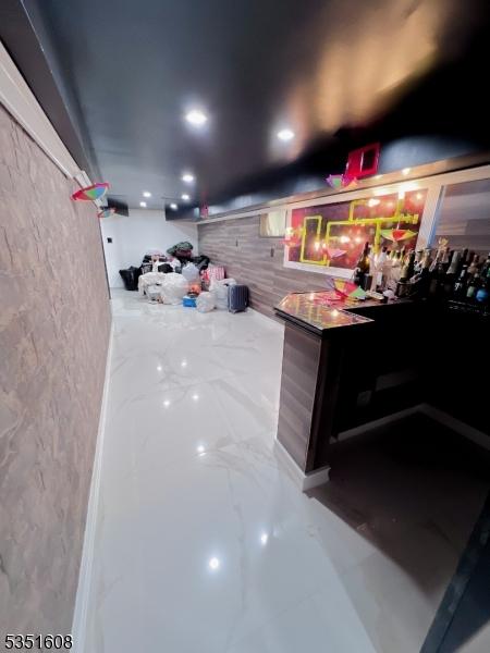79 Shaler Ave, Fairview Boro, NJ 07022 - bar with marble tiled floors