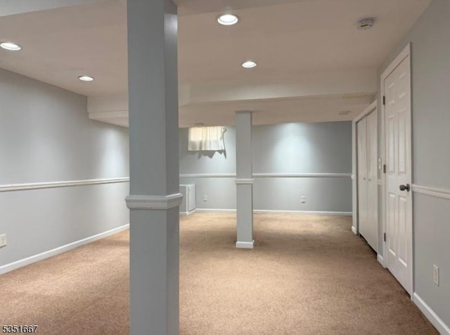 finished below grade area featuring baseboards, carpet, and recessed lighting