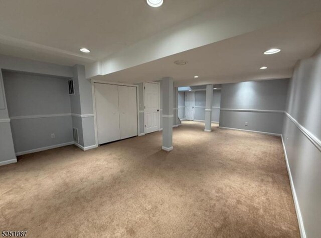 finished below grade area featuring recessed lighting, carpet flooring, and baseboards