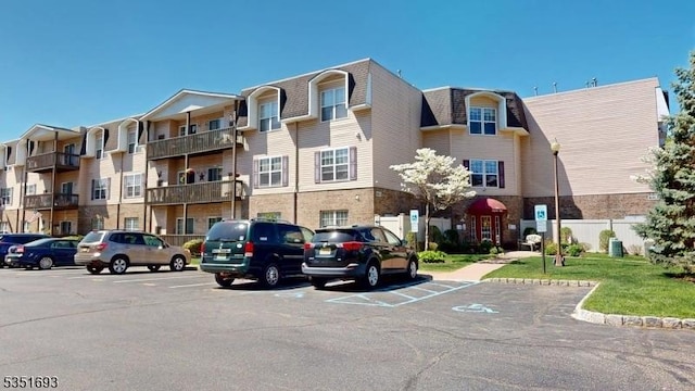 view of property featuring uncovered parking