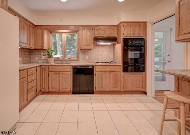 27 Belgrade Ter, West Orange Twp, NJ 07052 - kitchen with black appliances, under cabinet range hood, light brown cabinets, tasteful backsplash, and recessed lighting