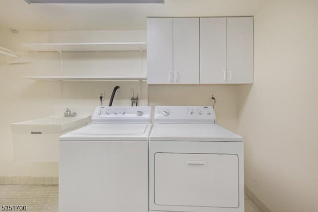 27 Belgrade Ter, West Orange Twp, NJ 07052 - laundry room featuring cabinet space, washing machine and clothes dryer, tile patterned floors, and baseboards
