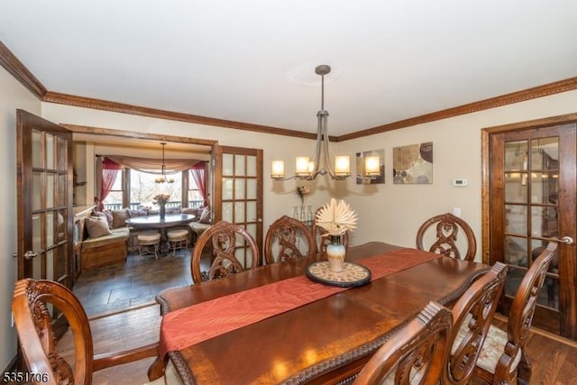 dining space featuring crown molding, an inviting chandelier, and french doors