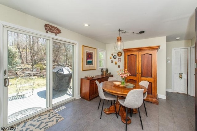 tiled dining area with baseboards, visible vents, and recessed lighting