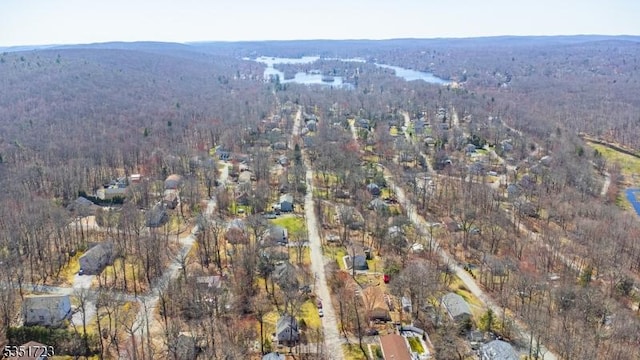 drone / aerial view featuring a forest view