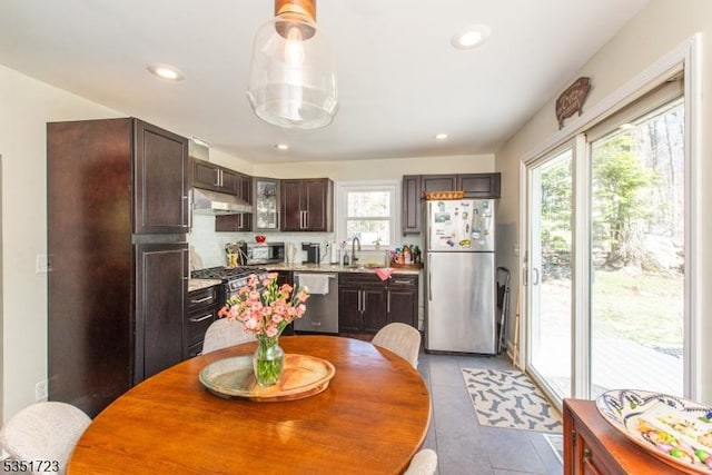 dining area featuring light tile patterned flooring and recessed lighting
