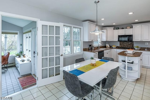 161 Orchard Rd, Montgomery Twp, NJ 08558 - kitchen with black appliances, a wealth of natural light, dark countertops, and a sink