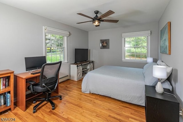 161 Orchard Rd, Montgomery Twp, NJ 08558 - bedroom featuring a ceiling fan, wood finished floors, and a baseboard radiator