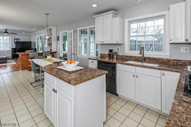 161 Orchard Rd, Montgomery Twp, NJ 08558 - kitchen with black dishwasher, light tile patterned floors, a kitchen island, and a sink