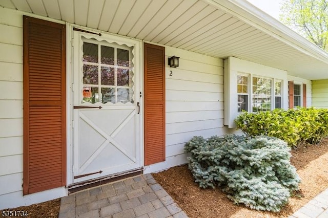 doorway to property featuring a porch