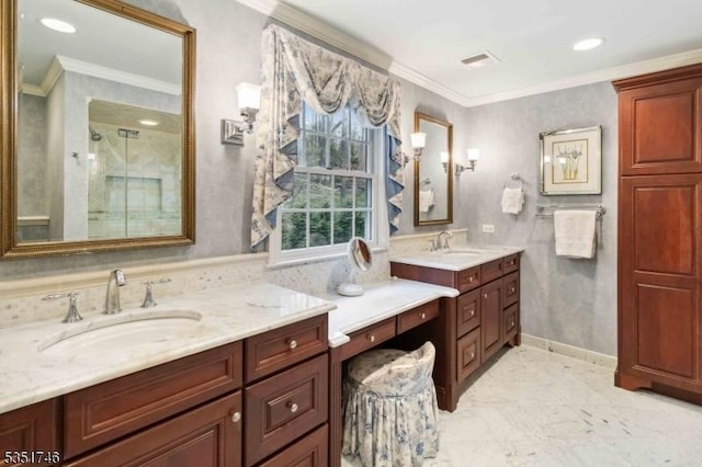 full bath featuring a shower stall, two vanities, ornamental molding, and a sink